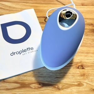 Lilac-colored Droplette device with charger. Box and capsules not included